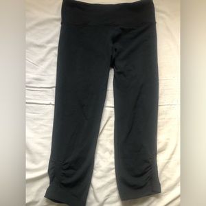 Lululemon black leggings slightly cropped ruching on the bottom